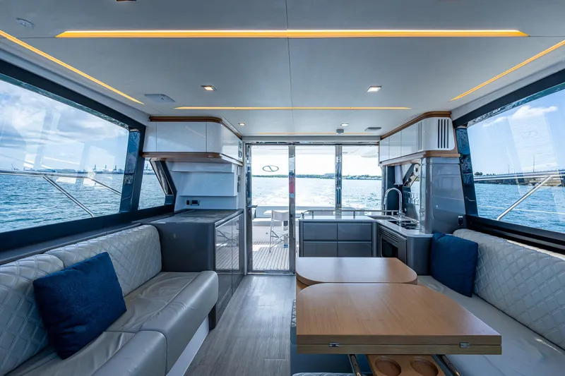 Suntastic Yacht Photos Pics Luxurious interior of 2023 Schaefer 450 yacht with modern seating and ocean view.