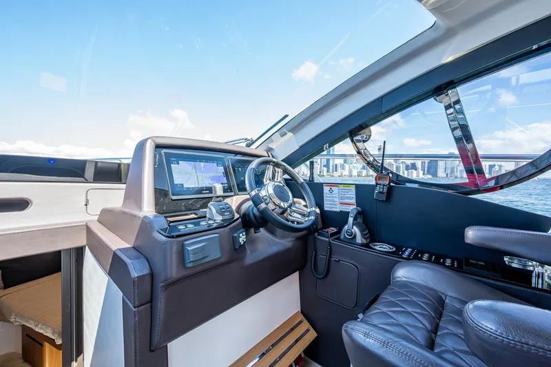 Suntastic Yacht Photos Pics Luxury interior of 2023 Schaefer 450 yacht cockpit with modern navigation equipment.