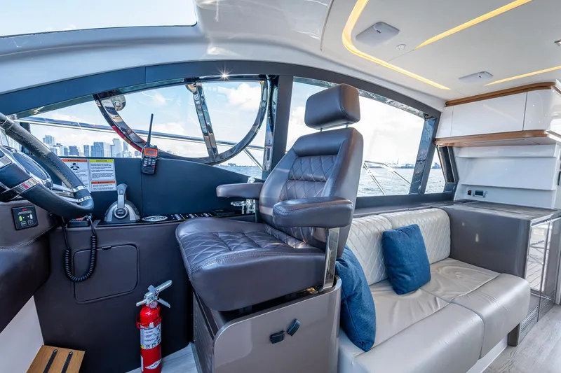 Suntastic Yacht Photos Pics Interior of 2023 Schaefer 450 yacht with helm, seating, and modern design.