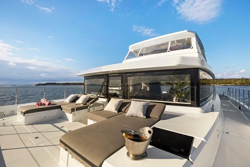 62 Iliad 2026 Yacht Photos Pics Luxurious ILIAD 62 yacht deck with sun loungers and ocean view, 2026 model.