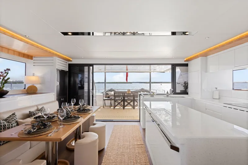 62 Iliad 2026 Yacht Photos Pics Luxurious interior of 2026 ILIAD 62 yacht with elegant dining and ocean view.