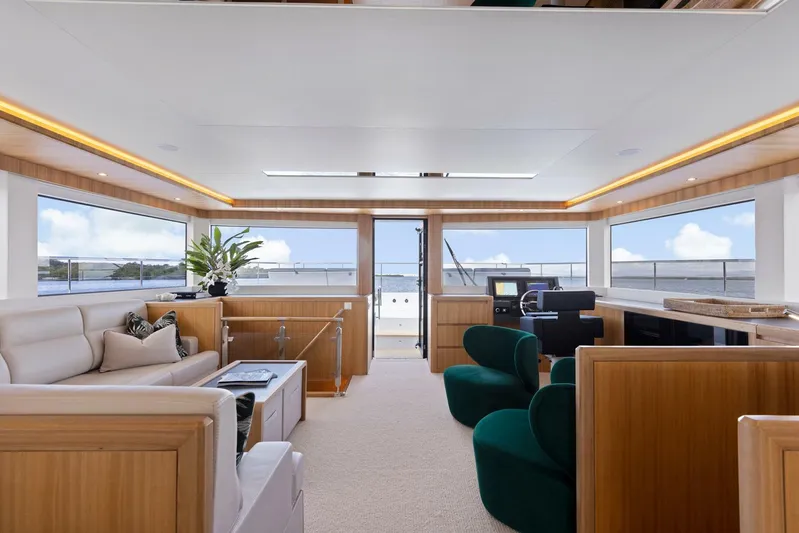 62 Iliad 2026 Yacht Photos Pics Luxurious interior of 2026 ILIAD 62 yacht with modern furnishings and panoramic windows.