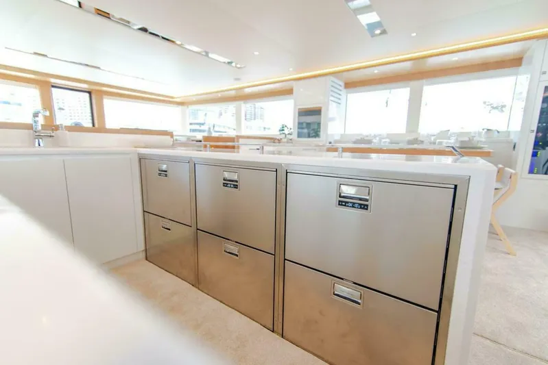 62 Iliad 2026 Yacht Photos Pics Modern kitchen interior on ILIAD 62 yacht, featuring sleek stainless steel appliances, 2026 model.