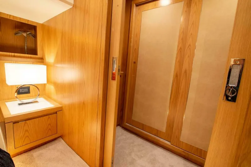 62 Iliad 2026 Yacht Photos Pics Luxurious interior of 2026 ILIAD 62 yacht with wooden paneling and modern lighting.