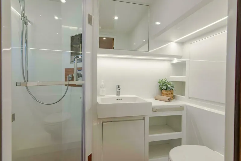 62 Iliad 2026 Yacht Photos Pics Modern bathroom in ILIAD 62 yacht, featuring sleek design and elegant fixtures, 2026 model.