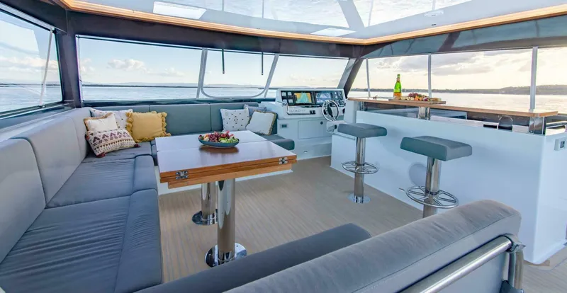 62 Iliad 2026 Yacht Photos Pics Luxurious interior of 2026 ILIAD 62 yacht with modern seating and panoramic views.