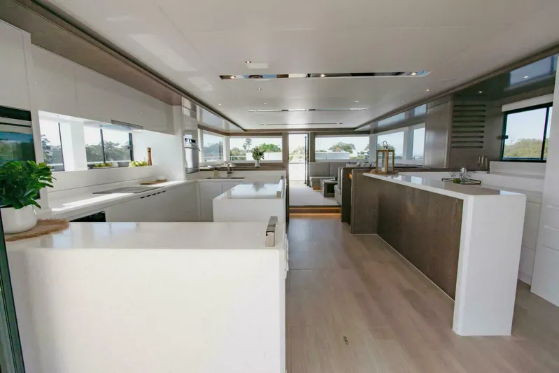 62 Iliad 2026 Yacht Photos Pics Luxurious modern kitchen interior on ILIAD 62 yacht, 2026 model, featuring sleek design and ample natural light.