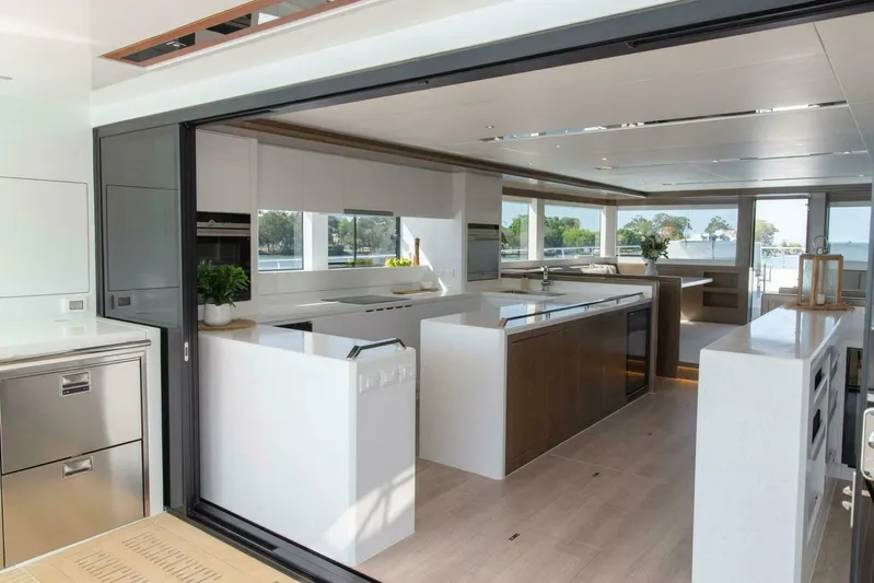 62 Iliad 2026 Yacht Photos Pics Luxurious modern kitchen interior on ILIAD 62 yacht, 2026 model, with sleek design and ample natural light.
