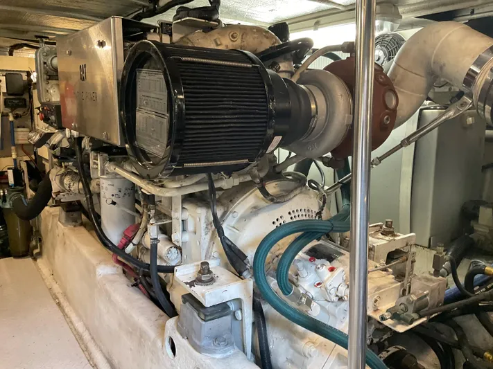  Yacht Photos Pics Engine room of a 1999 Sea Ray 560 Sedan Bridge yacht, showcasing mechanical components.