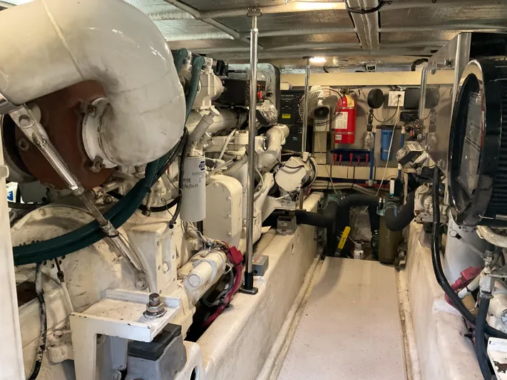  Yacht Photos Pics Engine room of a 1999 Sea Ray 560 Sedan Bridge yacht, showcasing machinery and equipment.