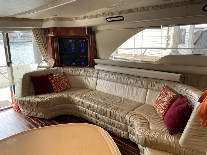  Yacht Photos Pics Luxurious interior of 1999 Sea Ray 560 Sedan Bridge yacht with plush seating and elegant decor.