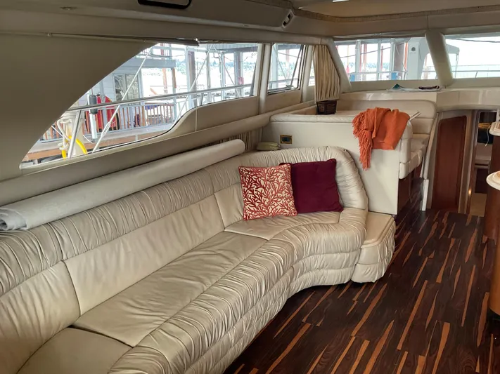  Yacht Photos Pics Luxurious interior of a 1999 Sea Ray 560 Sedan Bridge yacht with plush seating.