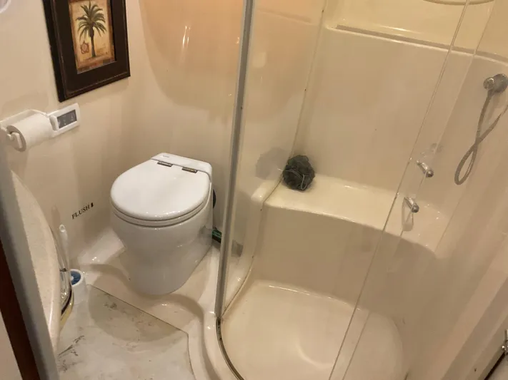  Yacht Photos Pics Bathroom interior of 1999 Sea Ray 560 Sedan Bridge yacht with shower and toilet.