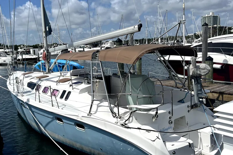 Willoughby Yacht Photos Pics 2002 Hunter 460 sailboat docked at marina under clear blue sky.