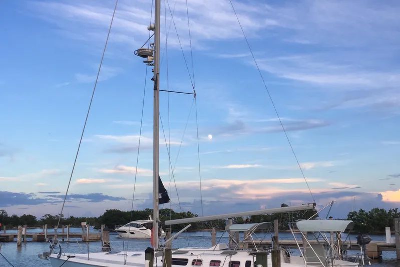 Willoughby Yacht Photos Pics Sailboat Hunter 460, 2002 model, docked at marina under a vibrant evening sky.