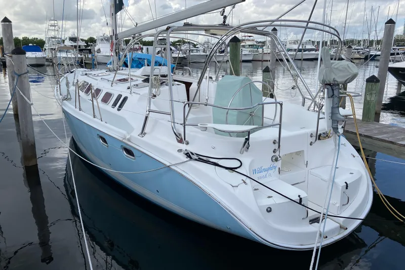 Willoughby Yacht Photos Pics 2002 Hunter 460 sailboat docked at marina, featuring sleek design and spacious deck.