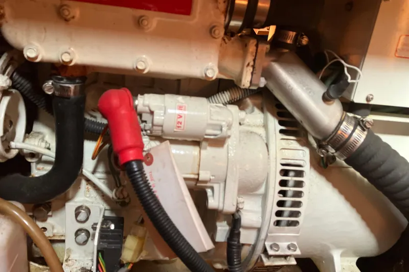 Willoughby Yacht Photos Pics Engine components of a 2002 Hunter 460 boat, featuring hoses and wiring.