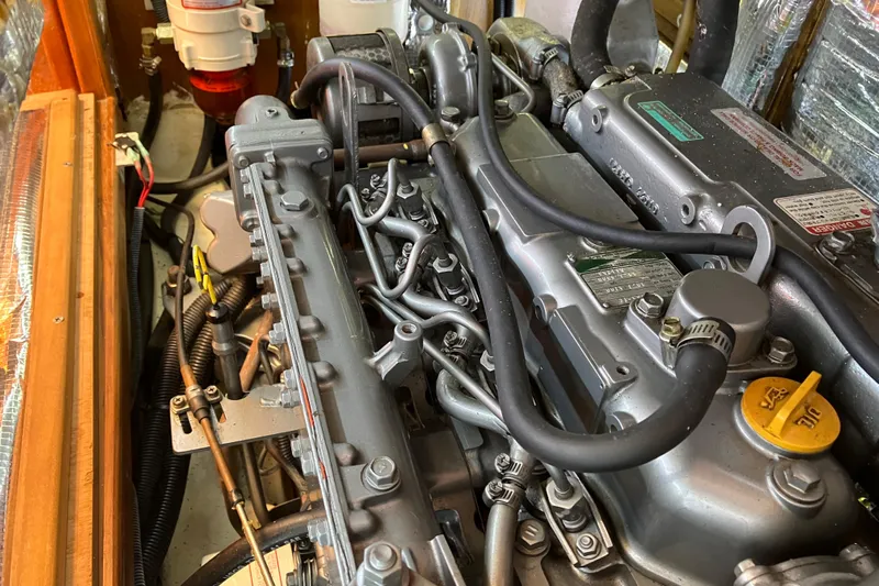 Willoughby Yacht Photos Pics Engine compartment of a 2002 Hunter 460 sailboat, showcasing detailed mechanical components.