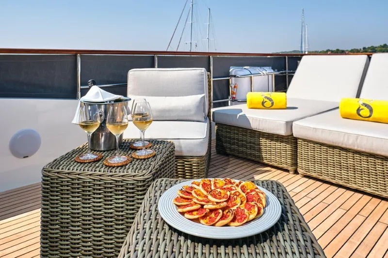  Yacht Photos Pics Luxurious Selene 72 Explorer yacht deck with wine, snacks, and comfortable seating, 2026 model.