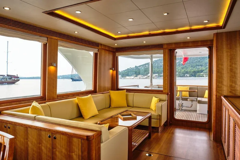  Yacht Photos Pics Luxurious interior of 2026 Selene 72 Explorer yacht with elegant wood finish and yellow accents.