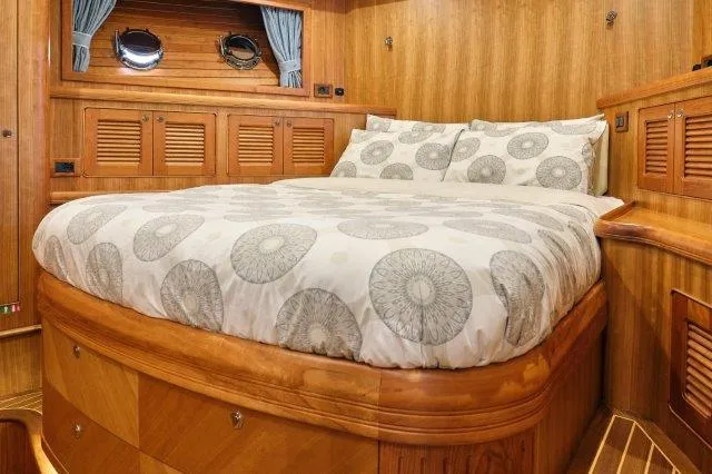 Yacht Photos Pics Luxurious cabin interior of 2026 Selene 72 Explorer yacht with elegant wood finish.