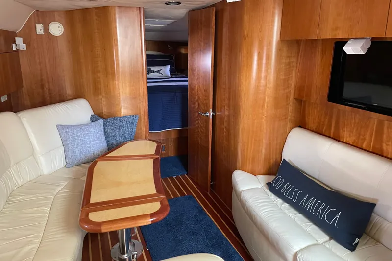 Radio Flyer Yacht Photos Pics Luxurious 2005 Tiara Yachts 4400 Sovran interior with elegant wood finish and cozy seating.