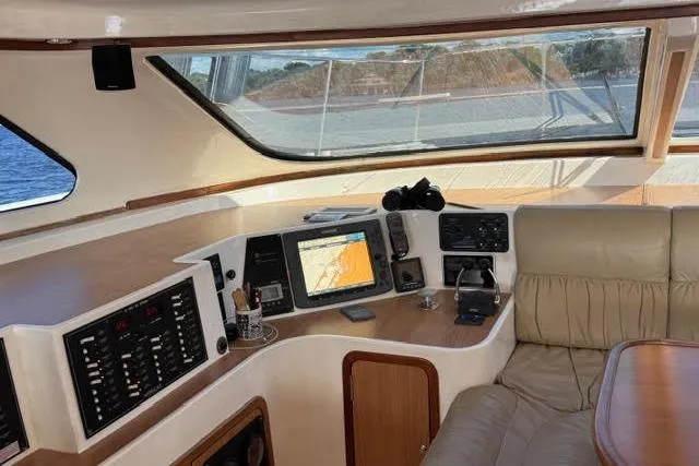 Sea Angel Yacht Photos Pics Luxurious 2007 Africat Marine 420 yacht interior with navigation equipment and comfortable seating.