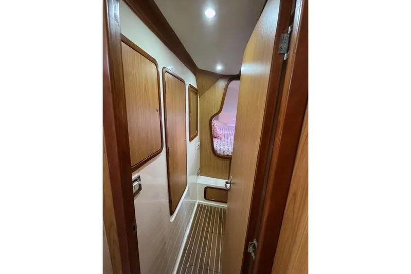 Sea Angel Yacht Photos Pics 2007 Africat Marine 420 yacht interior hallway with wood paneling and cozy cabin view.