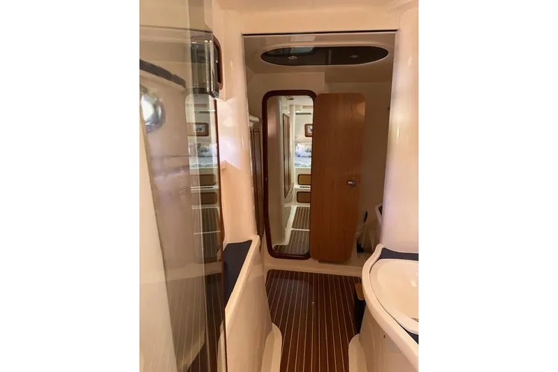 Sea Angel Yacht Photos Pics Interior of 2007 Africat Marine 420 yacht, featuring sleek wood finishes and modern design.