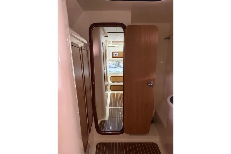 Sea Angel Yacht Photos Pics Interior view of 2007 Africat Marine 420 yacht, featuring wooden doors and flooring.