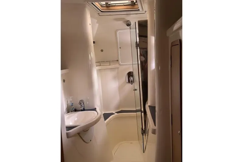 Sea Angel Yacht Photos Pics Luxurious bathroom interior of 2007 Africat Marine 420 yacht, featuring modern fixtures and skylight.