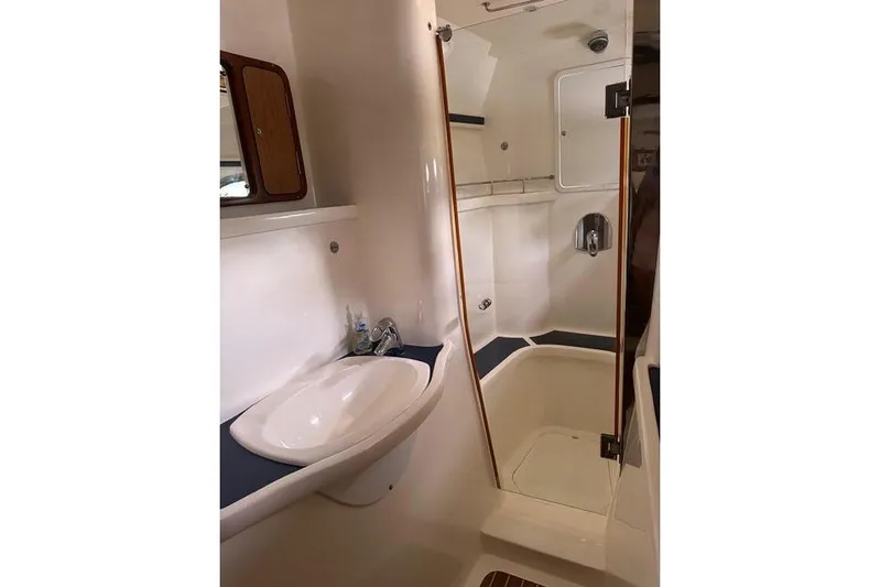 Sea Angel Yacht Photos Pics Bathroom interior of 2007 Africat Marine 420 yacht, featuring sink and shower.