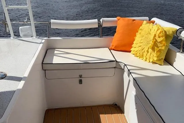 Sea Angel Yacht Photos Pics Cozy seating area on 2007 Africat Marine 420 yacht with colorful cushions.