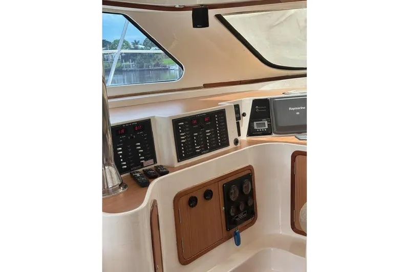 Sea Angel Yacht Photos Pics Control panel of a 2007 Africat Marine 420 boat, featuring navigation and communication equipment.