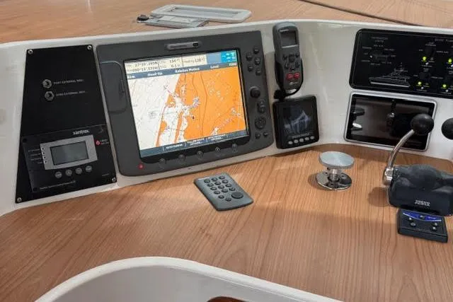 Sea Angel Yacht Photos Pics Control panel of a 2007 Africat Marine 420 with navigation and communication equipment.