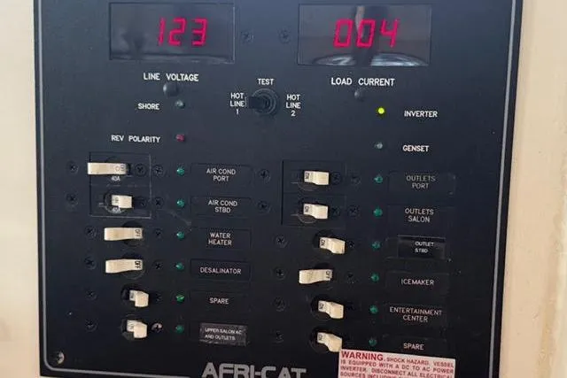 Sea Angel Yacht Photos Pics Electrical control panel on a 2007 Africat Marine 420 boat, displaying voltage and current.