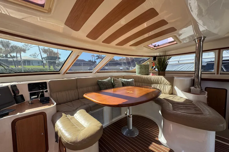 Sea Angel Yacht Photos Pics Luxurious interior of 2007 Africat Marine 420 yacht with plush seating and elegant wood finishes.