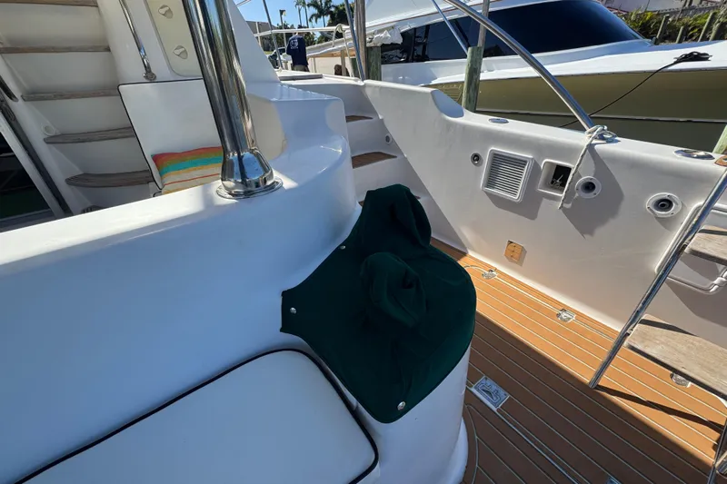 Sea Angel Yacht Photos Pics 2007 Africat Marine 420 yacht deck with seating and stairs, featuring sleek design elements.