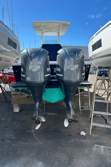  Yacht Photos Pics 2013 Regulator 26 FS boat with twin Yamaha 250 engines, docked outdoors.