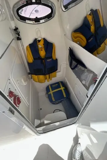  Yacht Photos Pics Interior of 2013 Regulator 26 FS boat with life jackets and storage.