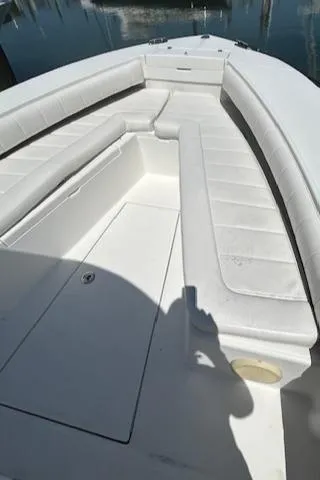  Yacht Photos Pics 2013 Regulator 26 FS boat with spacious white seating and sleek design.