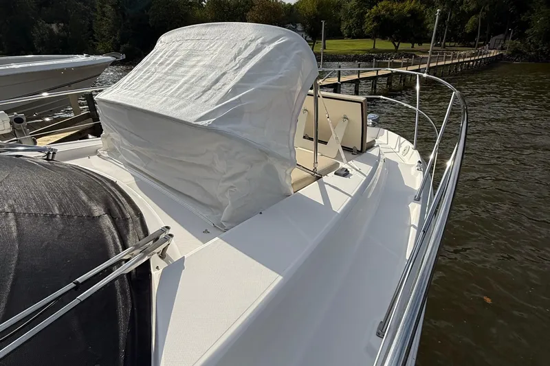 Tomtanic Yacht Photos Pics 2019 Regal 42 Fly yacht docked by a scenic waterfront.