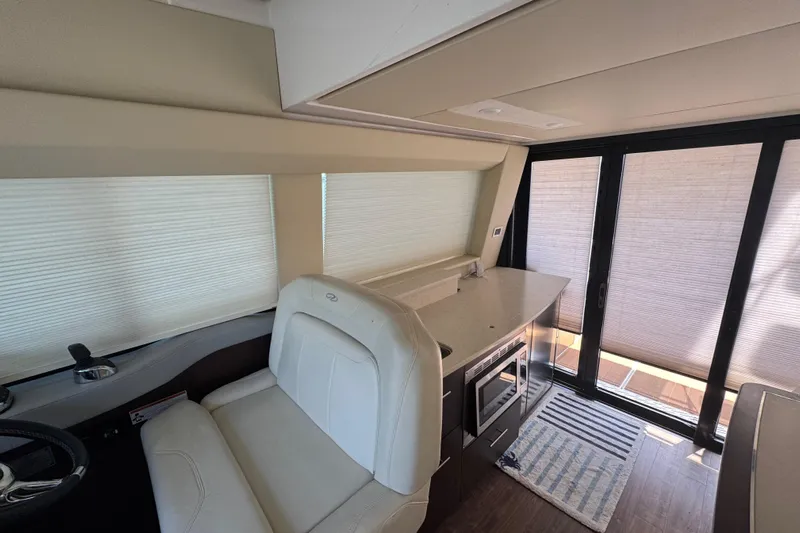 Tomtanic Yacht Photos Pics Interior of 2019 Regal 42 Fly yacht with modern kitchen and seating area.