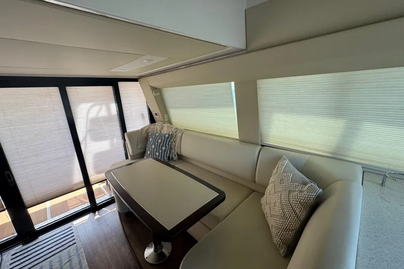 Tomtanic Yacht Photos Pics Luxurious interior of 2019 Regal 42 Fly yacht with elegant seating and modern decor.