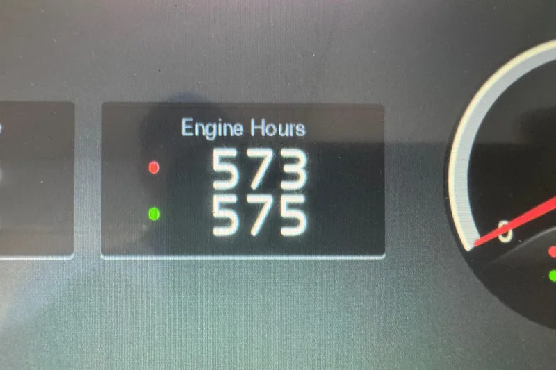 Tomtanic Yacht Photos Pics Engine hours display on 2019 Regal 42 Fly, showing 573 and 575 hours.