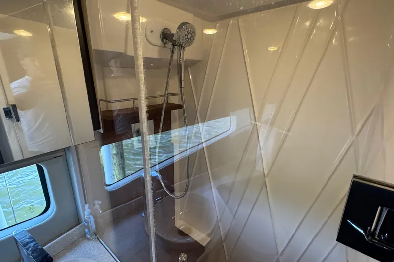 Tomtanic Yacht Photos Pics Luxurious bathroom interior of 2019 Regal 42 Fly yacht with modern shower design.