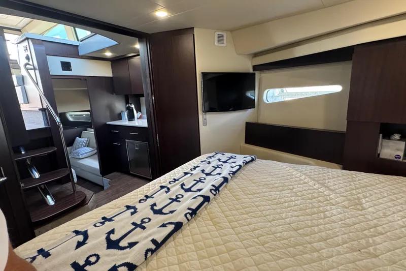 Tomtanic Yacht Photos Pics Luxurious interior of 2019 Regal 42 Fly yacht with cozy bedroom and modern amenities.
