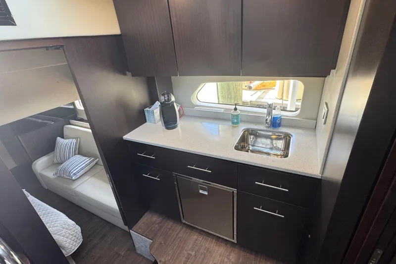 Tomtanic Yacht Photos Pics Luxurious 2019 Regal 42 Fly yacht interior kitchen with modern amenities.