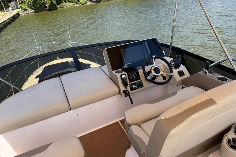 Tomtanic Yacht Photos Pics 2019 Regal 42 Fly yacht helm with modern controls and comfortable seating on the water.