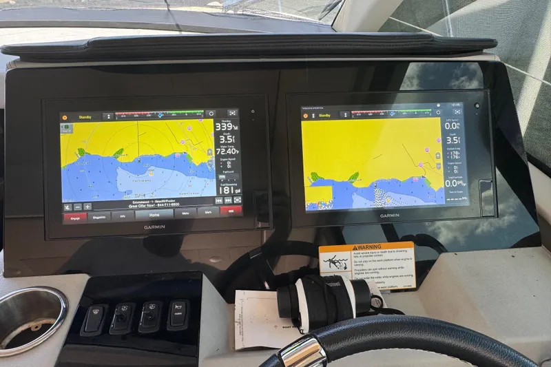 Tomtanic Yacht Photos Pics Garmin navigation screens on 2019 Regal 42 Fly yacht dashboard.